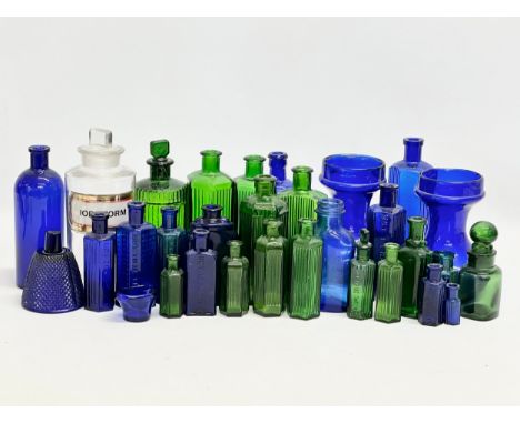 A collection of vintage chemist bottles