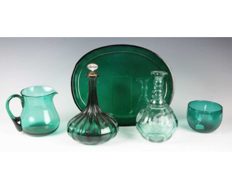 A rib moulded green glass decanter and stopper, second quarter 19th century, of onion shape, the cork stopper with mother-of-