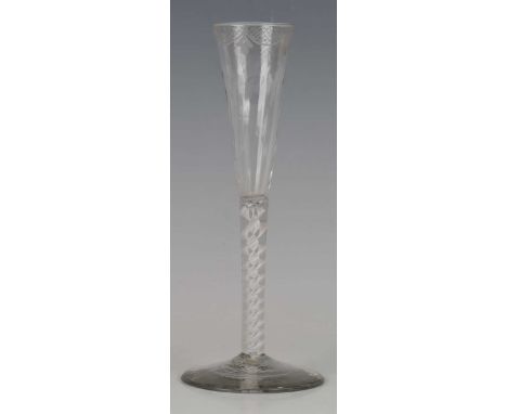 A double series opaque twist stem ratafia glass or flute, circa 1770, the slender drawn bowl moulded with flutes and engraved