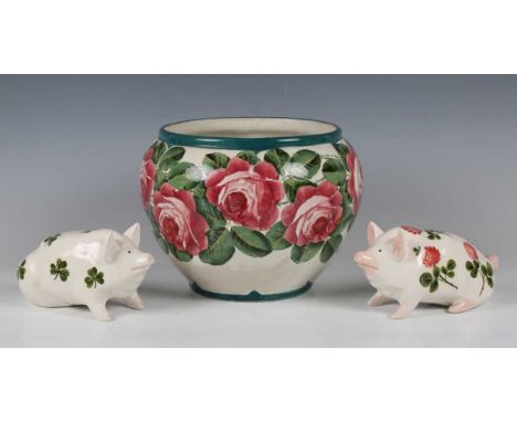 Two Griselda Hill Pottery Wemyss style small pigs, the first painted with shamrock, the second clover, painted marks to bases
