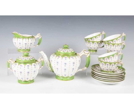 A Royal Worcester part tea service, dated 1907, decorated with vertical rows of cornflowers within gilt edged pale green glaz
