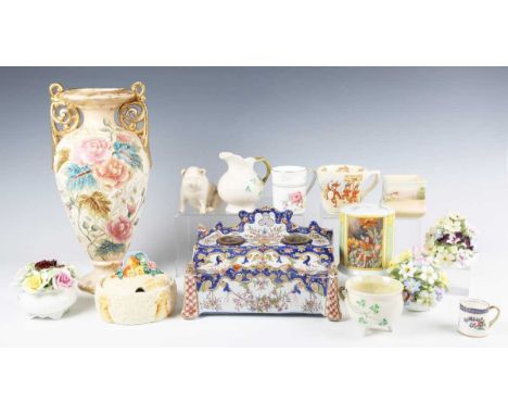 A French faience inkstand, late 19th/early 20th century, of rectangular shape, painted with flower baskets and garlands withi