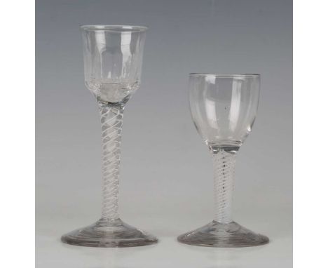A mixed twist stem wine glass, circa 1765, the ogee bowl with basal flute moulding, raised on a plain stem with four spiral t