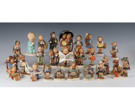 Twenty-six Goebel Hummel figures, including Retreat To Safety, Wayside Harmony, Congratulations and Latest News, together wit