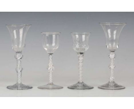 A double series opaque twist stem wine glass, circa 1770, the hammered bowl on a plain stem with six-ply threads outside a co