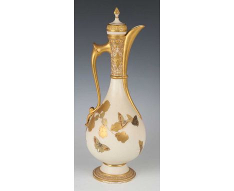 A Royal Worcester Islamic style ewer, dated 1882, decorated by James Sherriff, signed, the ivory ground pear shaped body gilt