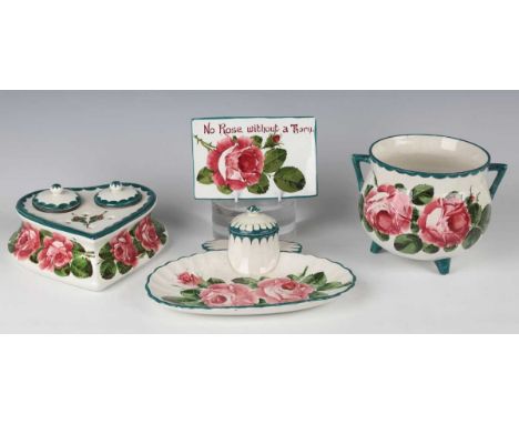 Four pieces of Wemyss pottery painted with pink cabbage roses, circa 1900 and early 20th century, comprising a rectangular dr