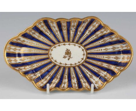 A Worcester spoon tray, circa 1765, of lobed hexagonal shape gilt with stylized foliage between cobalt blue sections, length 