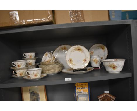 A selection of antique dinner service having pattern of dog violets in greens and burgundy including cups and saucers, sugar 