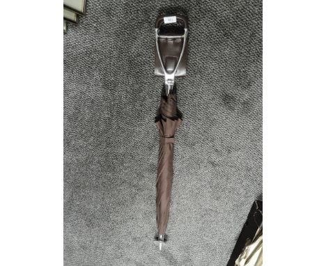 A vintage shooting stick with umbrella