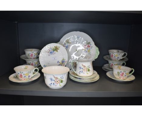 A part Shelley breakfast service, comprising of cups and saucers, jug, sugar basin and plates ,Wild flowers 13668'.