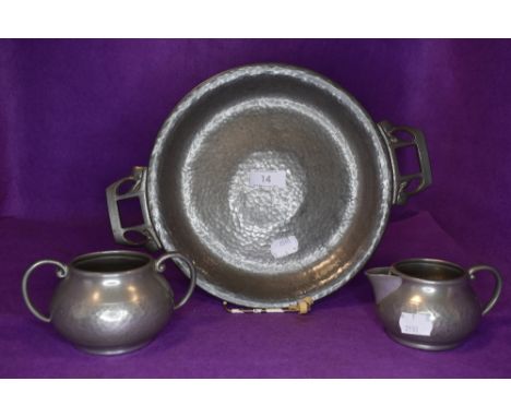 A Tudric pewter tazza or footed bowl having Art Nouveau styling and a Talbot pewter sugar basin and jug.