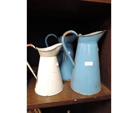 Three vintage graded enamel jugs.