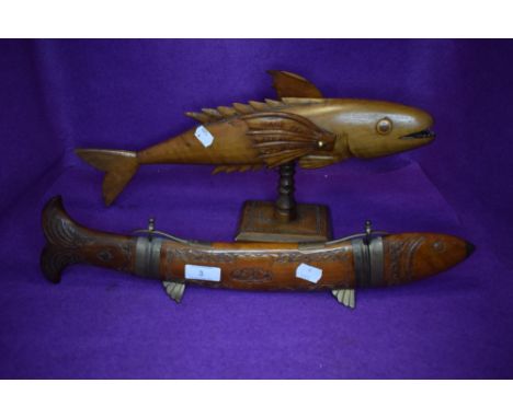 A vintage fish serving knife and fork in carved fish formed holder also included is a Pitcairn island carved wood flying fish