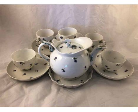 A small part set of Dutch Amstel porcelain (1784 - 1809) teaware, decorated with small blue flowers including three coffee cu