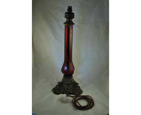 An Edwardian ruby glass and ormolu Table Lamp with bulbous column