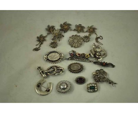 A small collection of silver and filigree Jewellery including Victorian Brooches, marcasite and faux pearl spray, amethyst an