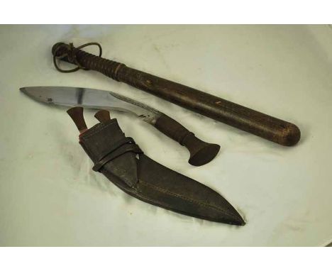 A WWII period Kukri complete with Scabbard and Knives, plus an early 20th century police truncheon