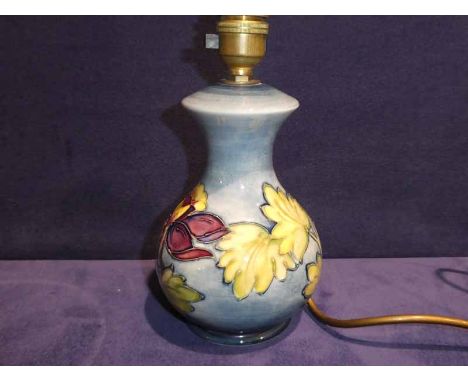 A Moorcroft Pottery Table Lamp Base, tubeline decorated with Aquilegia on pale blue ground, 17cm high plus fitting