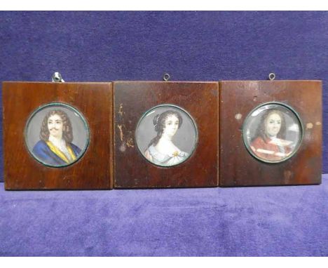 A set of three French 19th century Portrait Miniatures, depicting two noblemen and a noblewoman in 18th century dress, hand p