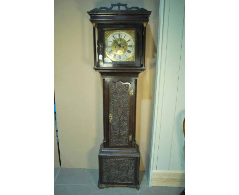 AN 18th century brass dial Long Case Clock by George Womersley with moon phase and date chapter in oak case with Macclesfield