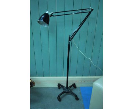 An unusual mid 20th century angle poise Standard Lamp on cast iron, counterweighted base on casters
