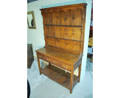 A George III style handmade oak Dresser with two shelf Plate Rack over a three drawer Pot Shelf, base 115.5cm