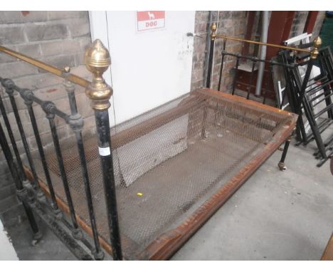 metal framed sprung bed with ceramic casters