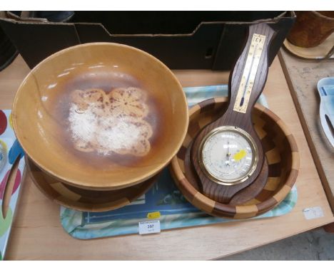 tray of wood bowls and barometer
