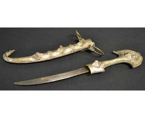 A 19th century Middle Eastern jambiya, 17cm curved blade, silver-coloured metal and gilt-brass mounted scabbard and grip cast