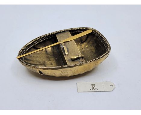 A silver-gilt model of a coracle, by Garrard & Co, London 1957, the marks also including crowned M, the monogram of Princess 