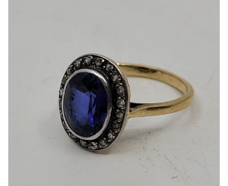 A 19th century precious yellow metal, sapphire and diamond ring, the oval mount having mixed oval cut sapphire to centre in r