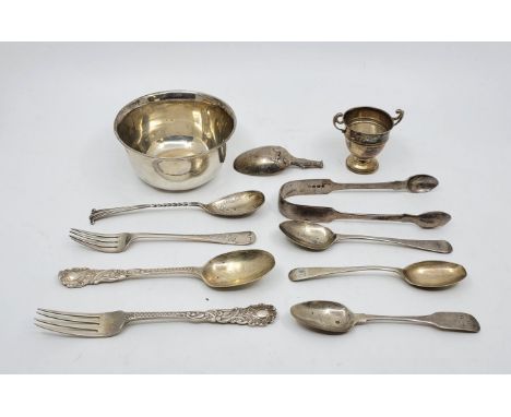 A collection of silver, to include: fiddle pattern sugar tongs, christening fork and spoon, a silver circular bowl, teaspoons