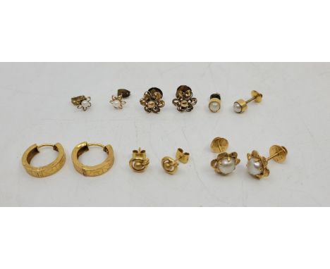 A pair of 22ct. gold stud earrings, (2.2g), together with a pair of 22ct. gold and pearl set flower form stud earrings (gross