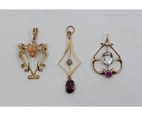 An Edwardian 14ct. rose gold, ruby and topaz set pendant, the pear shape mount set mixed cushion cut topaz to centre and mixe