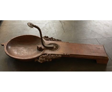 An Indian wooden lamp.&nbsp;