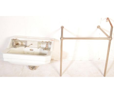 A large vintage 20th century Art Deco period reclaimed ceramic wash basin having original metal taps. Together with chrome to