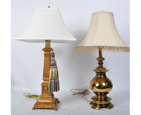 Two vintage 20th century gilt metal table lamps. To include a neoclassical table lamp having dentils and reeding to the base 
