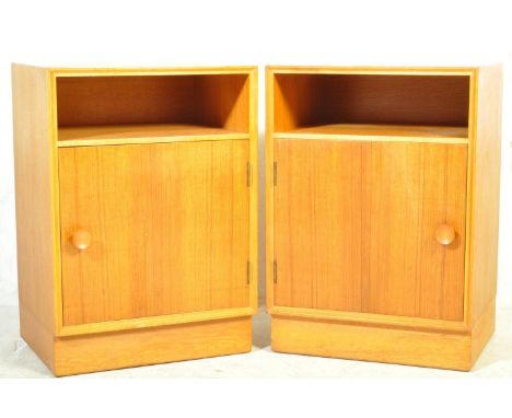 Meredew Furniture - A pair of rare and true mid century teak wood bedside cabinets - lockers. Each being raised on inset plin