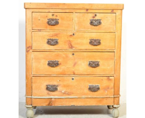 A Victorian 19th century country pine 2 over 3 chest of drawers. Raised on turned legs with 2 short over 3 deep drawers with 