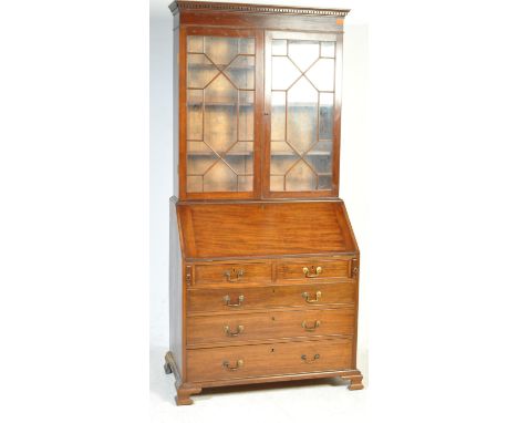 A 19th century George III mahogany bureau bookcase. Raised on bracket feet with chest of drawers under fully appointed bureau