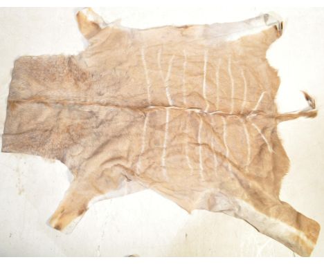 A vintage retro mid 20th century reindeer skin pelt floor rug carpet.&nbsp;