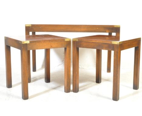 A 20th century Campaign revival mahogany and brass bound coffee and side table suite. Comprising two lamp / side tables and a
