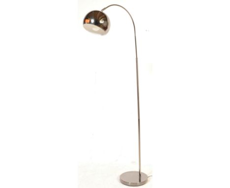 A retro vintage style chrome floor lamp in the manner of Harvey Guzzini. The lamp having an adjustable domed spherical shade 