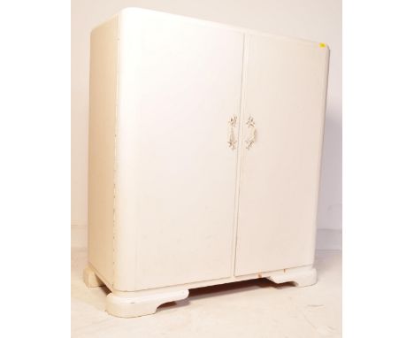 An early 20th century circa. 1930's Art Deco painted compactum linen press wardrobe having a fully appointed interior and bei
