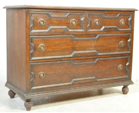 A 20th century Jacobean Revival oak chest of drawers having a flared chamfered edge, blocked geometric patterns to the drawer