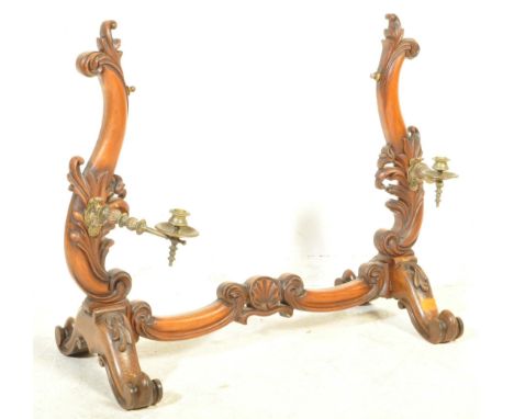 A high Victorian 19th century mahogany toilet dressing table mirror of rococo form complete with the original brass candlesti