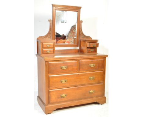 A late 19th century Victorian walnut dressing chest of drawers. Raised on bracket feet with a chest of drawers having short a