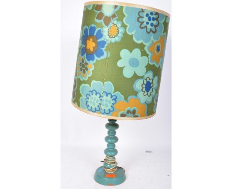 A retro vintage circa. 1960's turned wood table lamp having a turned wood painted blue base with shade covered in an abstract