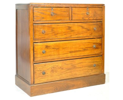 An early 20th century oak chest of drawers in the Arts &amp; Crafts manner.&nbsp; The chest being raised on a plinth base wit